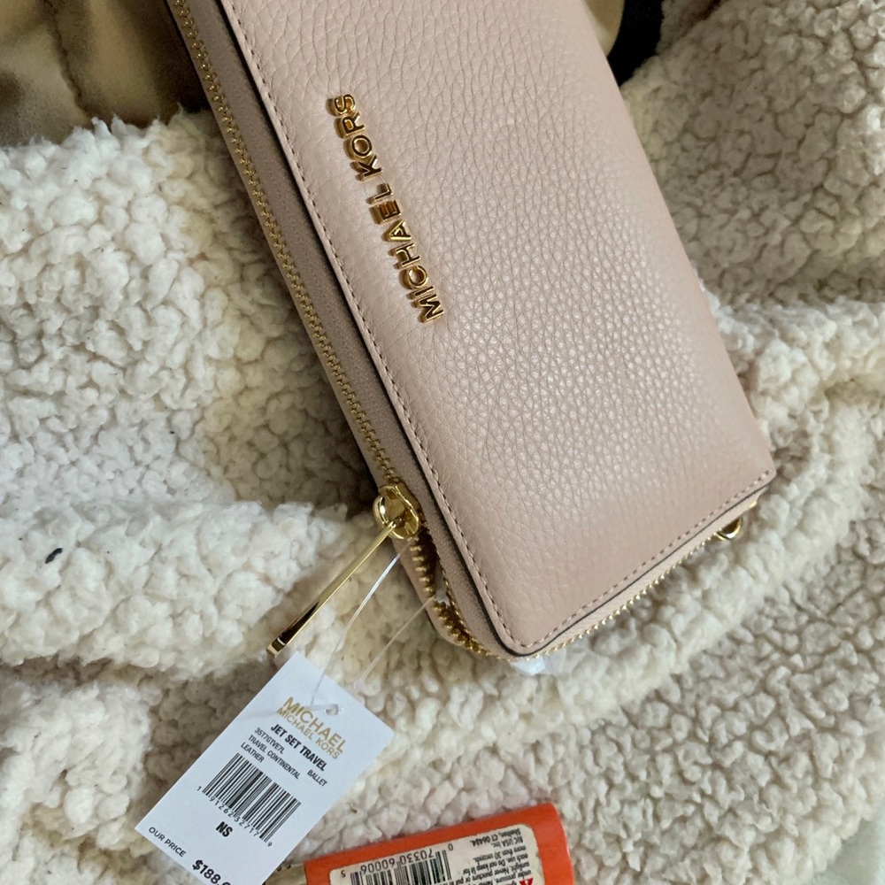 Michael Kor’s baby pink wallet